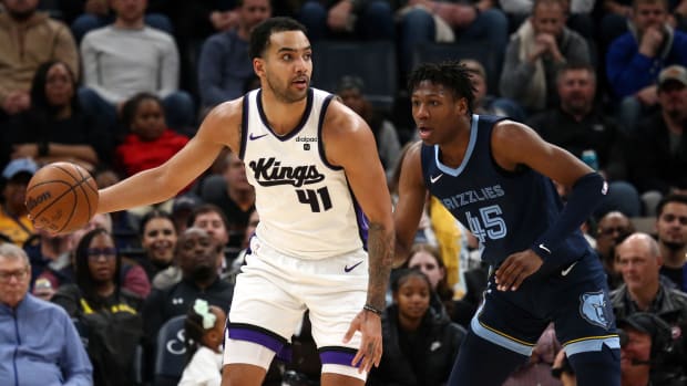 Jan 29, 2024; Memphis, Tennessee, USA; Sacramento Kings forward Trey Lyles (41) handles the ball as Memphis Grizzlies forward GG Jackson (45) defends during the second half at FedExForum. Mandatory Credit: Petre Thomas-USA TODAY Sports  